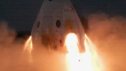 SpaceX' Crew Dragon's thrusters blaze during test fire