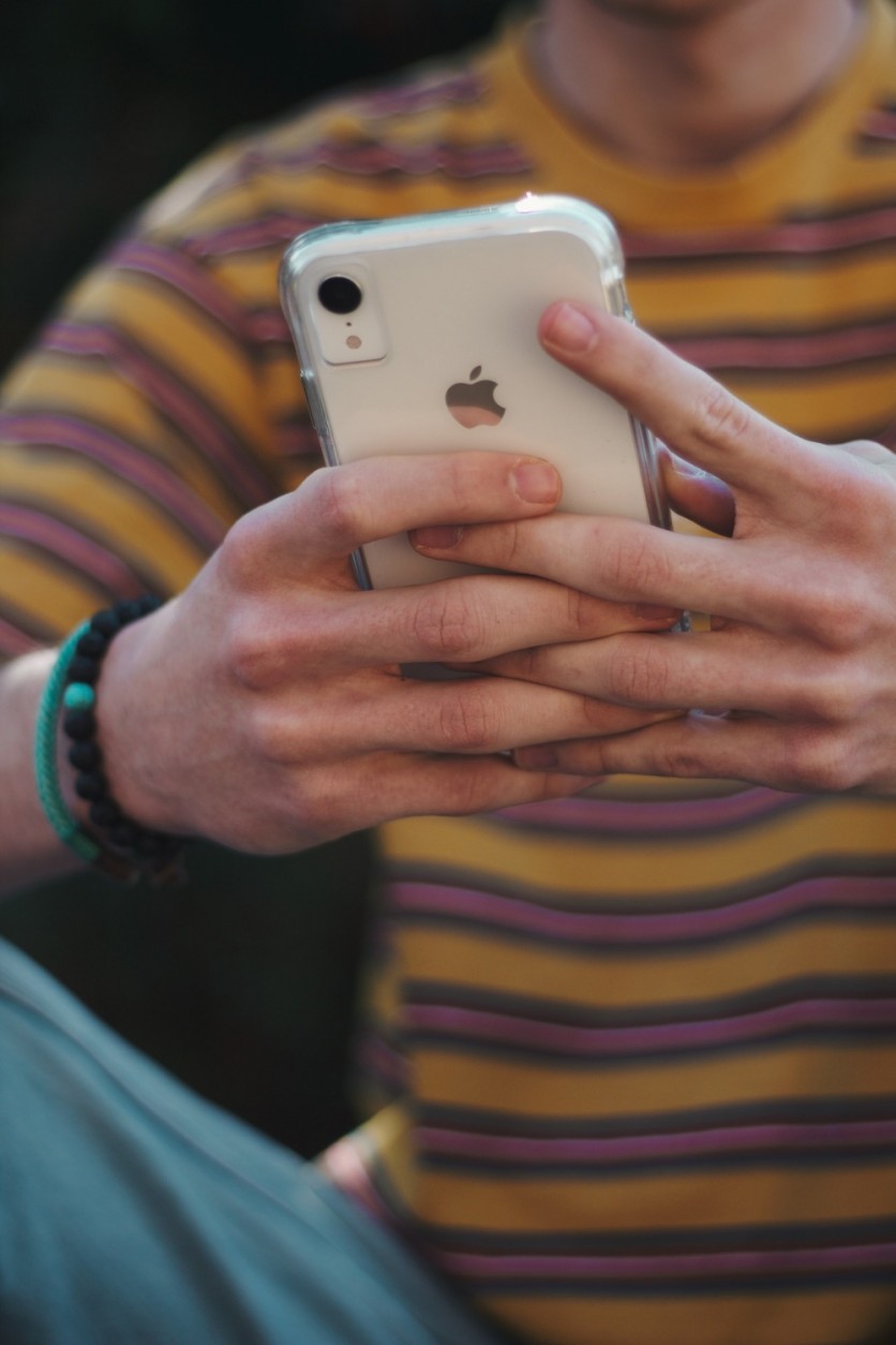 Man using an iPhone XR