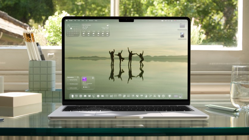 MacBook with redesigned macOS home screen and transparent widgets