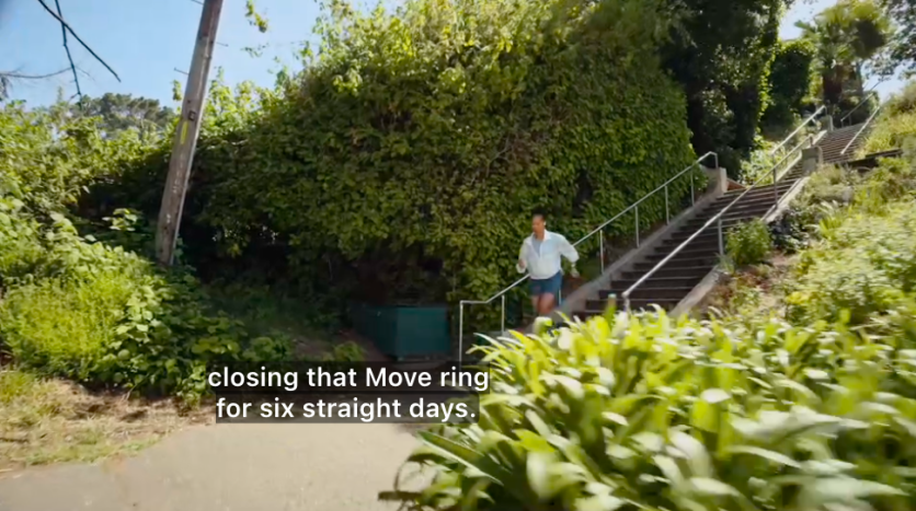 Person running down stairs outdoors tracking Apple Watch Move ring