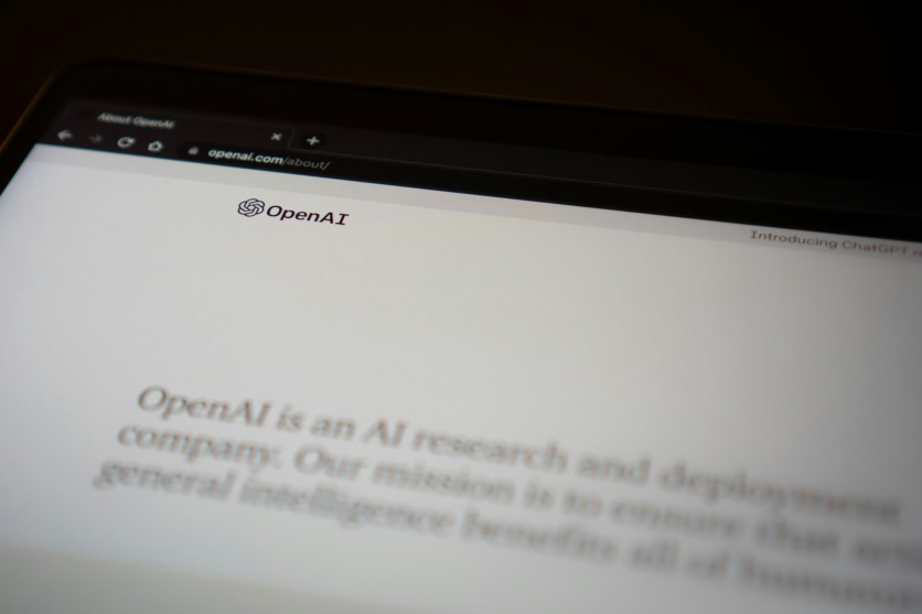 OpenAI website displayed on a laptop screen