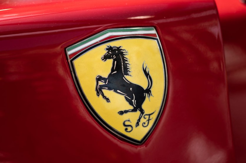 Ferrarri logo on a red car door