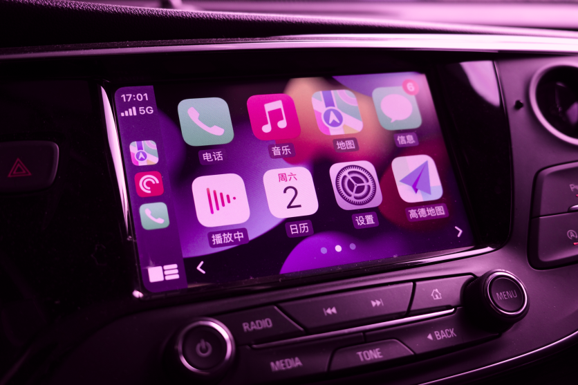 Pink-tinted Apple CarPlay dashboard screen
