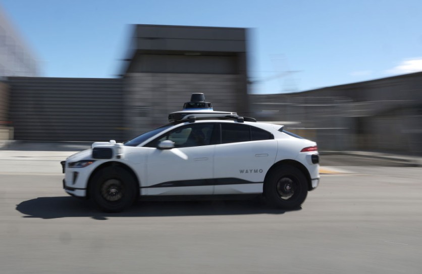 Waymo robotaxi driving on city street