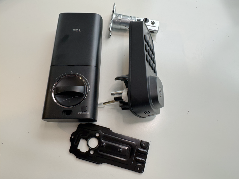 TCL D1 smart lock parts laid out on table