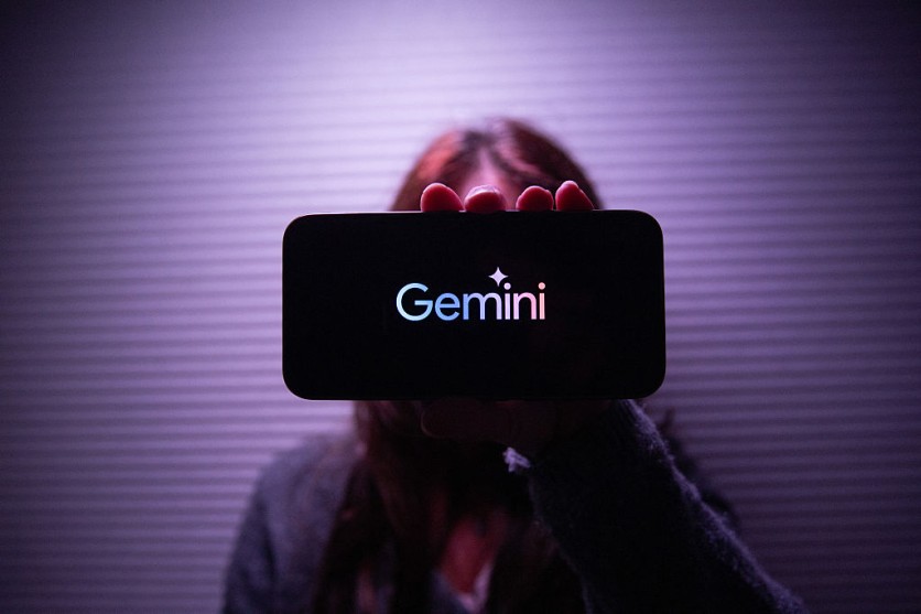 Person holding phone with Gemini logo