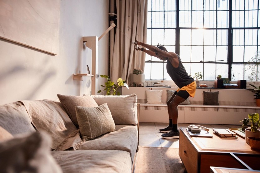 AI-generated workout plan interface on smart home gym equipment