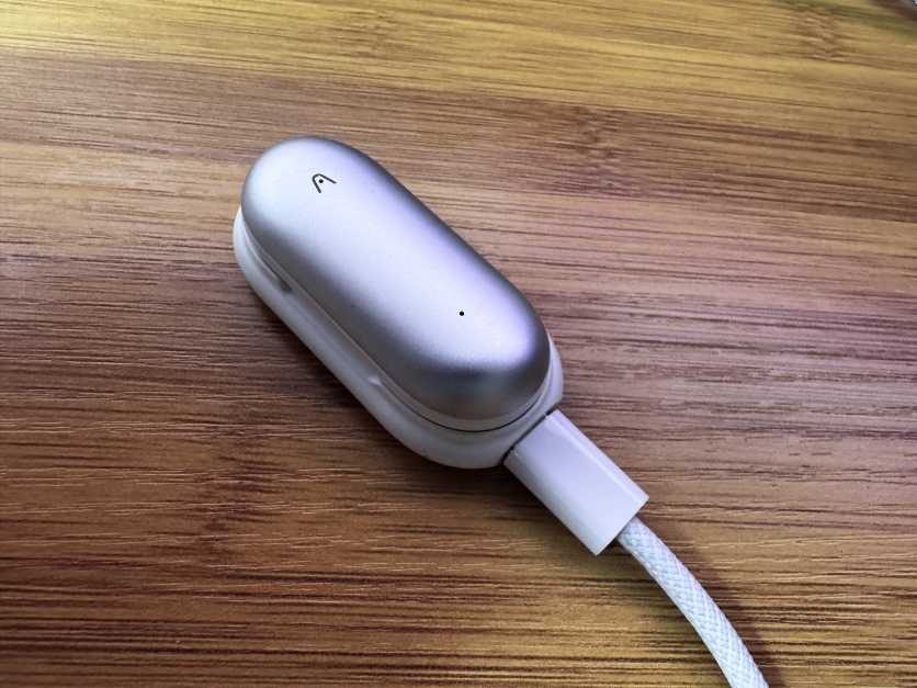 Notepin on wooden surface while charging