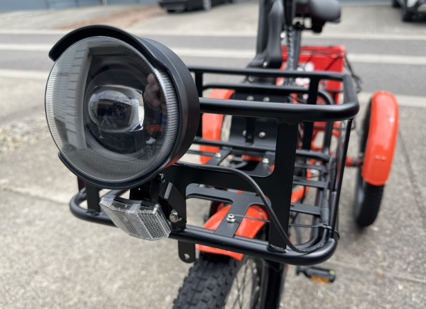 Close-up of front headlight on Mooncool TK1 trike