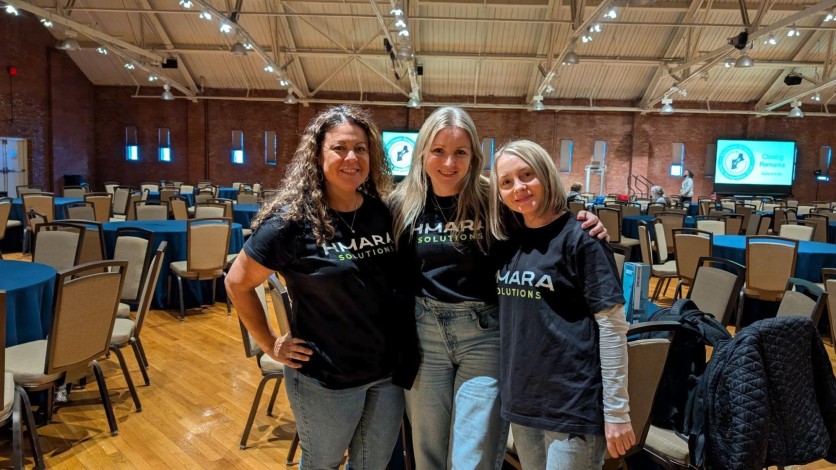 Alesia Dvorkina (center), Founder of Hmara Solutions