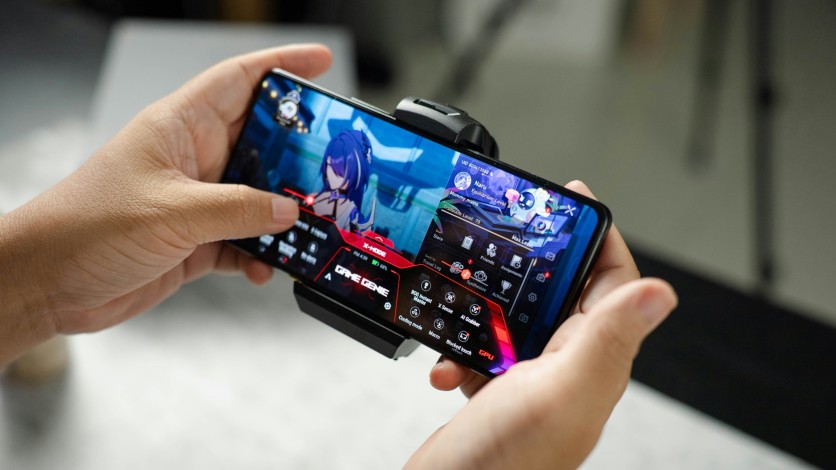 Person Playing Games on Phone