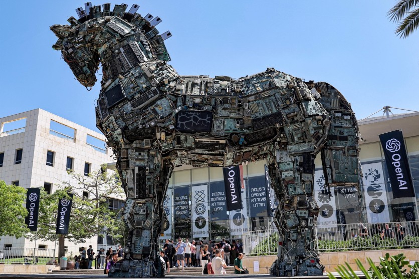 Banners of US artificial intelligence company OpenAI fly near an