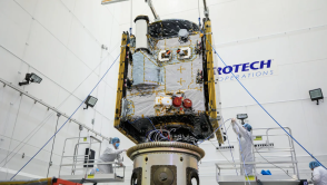 Technicians connect NASA's Psyche spacecraft to the payload attach fitting