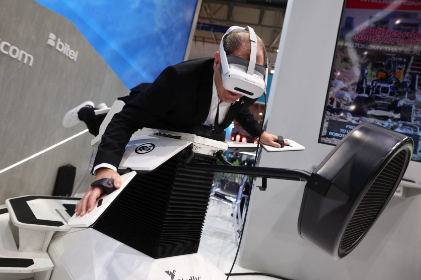 A visitor tries Birdly, a virtual reality simulator, during the