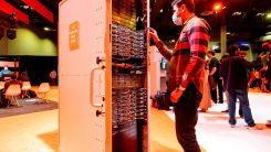 An Amazon Web Services (AWS) employee examines an AWS Outposts