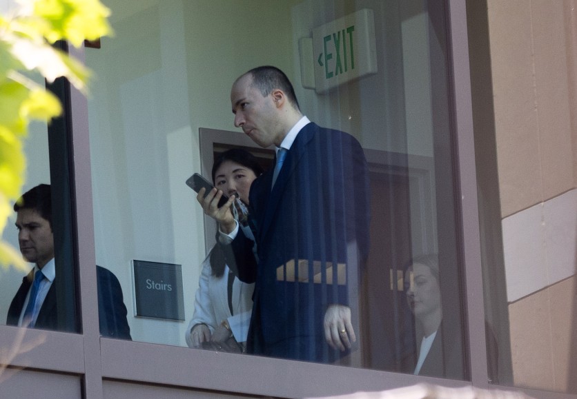 OpenAI President Gregory Brockman walks in the courthouse at the