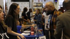 A job seeker meets with a recruiter during the HIRE360