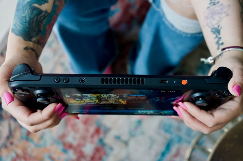 Person Holding Steam Deck OLED