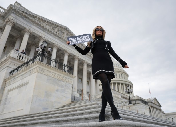 Paris Hilton poses at the U.S. Capitol after a press