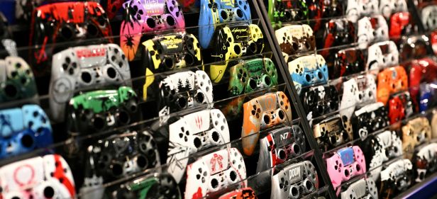 Customised PS5 controller faceplates are displayed for sale during DreamHack