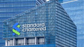 A Standard Chartered signage company signage is seen on a