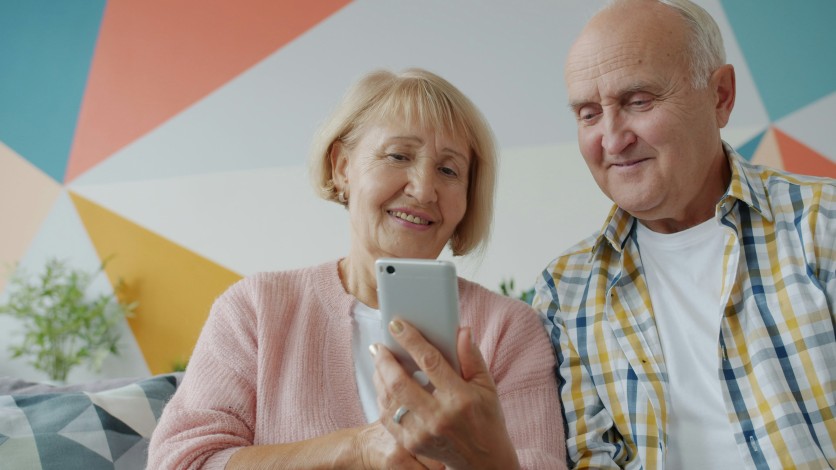 Elderly Couple Using Phone