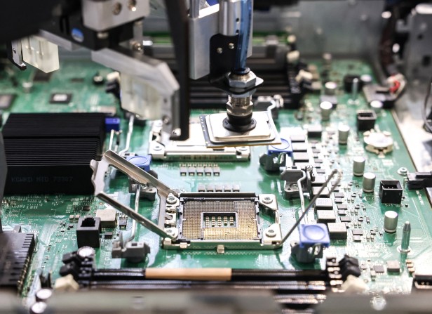 An AI server assembly station is displayed at the Century