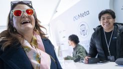A woman tries Meta smart glasses