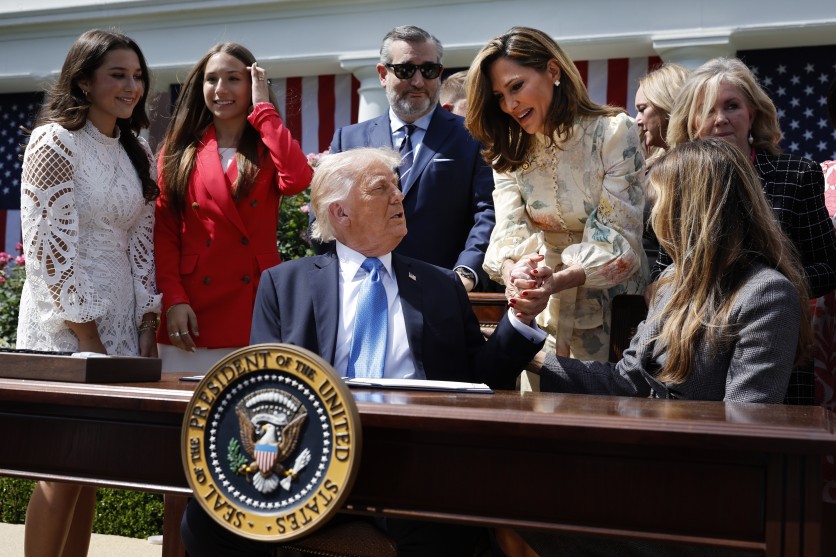 U.S. President Donald Trump shakes hands with Rep. Maria Elvira