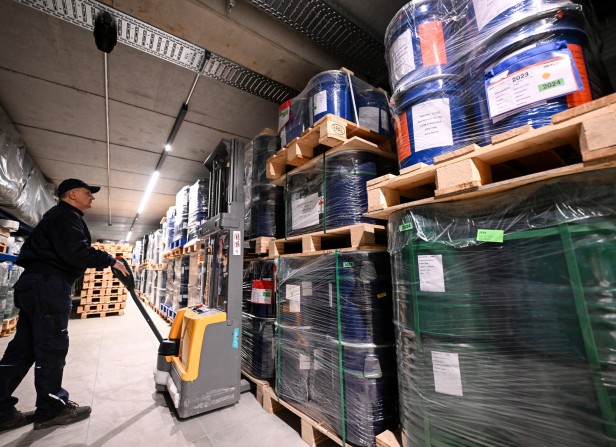 An employee works inside the storage room of Tradium, a