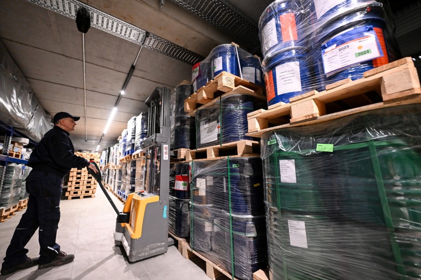 An employee works inside the storage room of Tradium, a