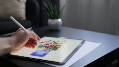 Person Drawing on Tablet