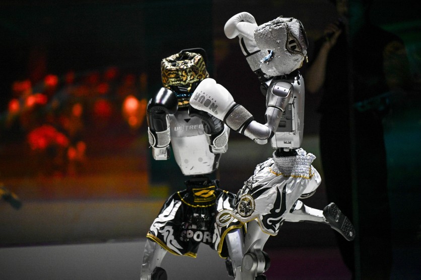 Humanoid robots perform in a kick-boxing fight during the Galaxy