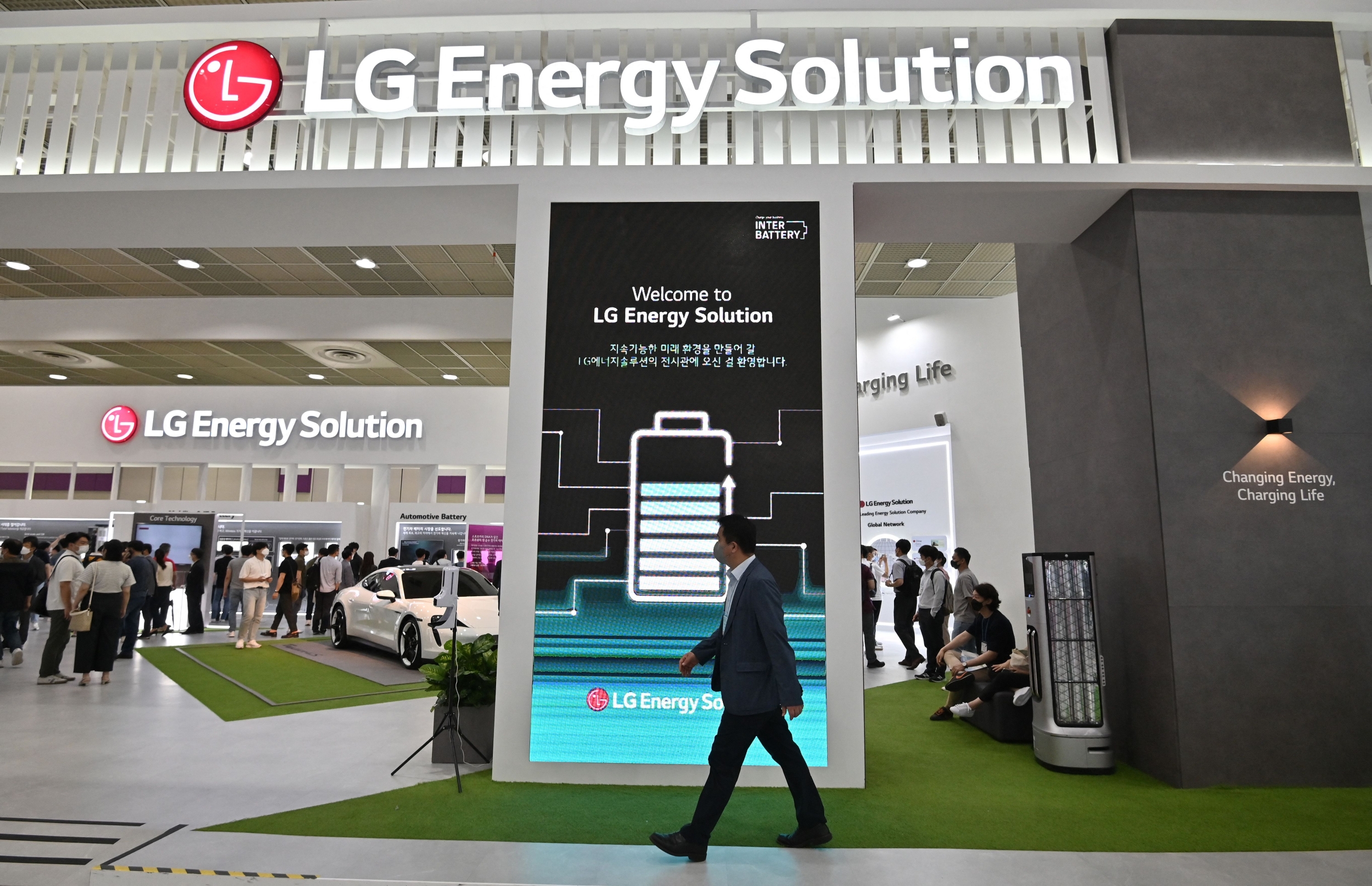 Visitors look at a booth of LG Energy Solution