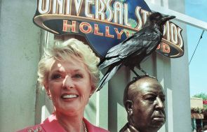 Former actress Tippi Hedren stands next to the unveiled bronze
