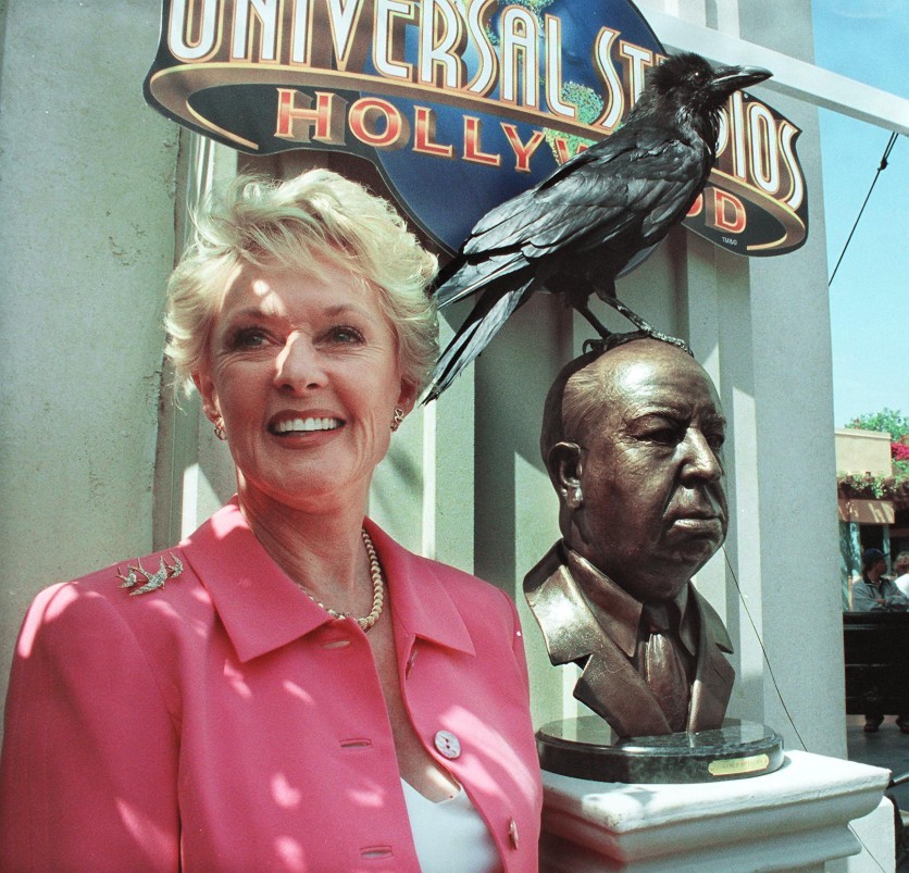Former actress Tippi Hedren stands next to the unveiled bronze