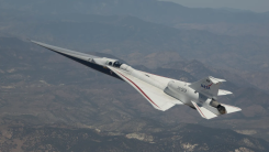 NASA’s X-59 quiet supersonic research aircraft flies above mountains near