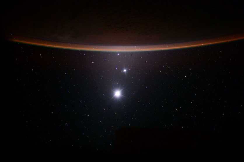 Crescent Earth above a lineup of Jupiter, Venus and Earth's