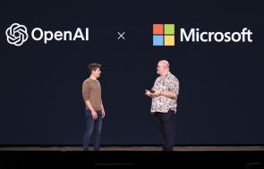 OpenAI CEO Sam Altman (L) speaks with Microsoft Chief Technology