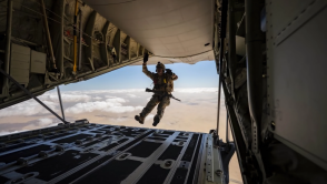Military Personnel Exiting Aircraft
