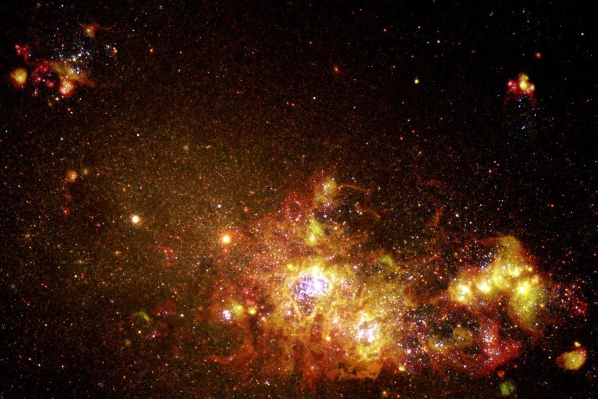 Hubble Catches Tiny Galaxy Clearing Cosmic Fog Just 1.4 Billion Years After the Big Bang