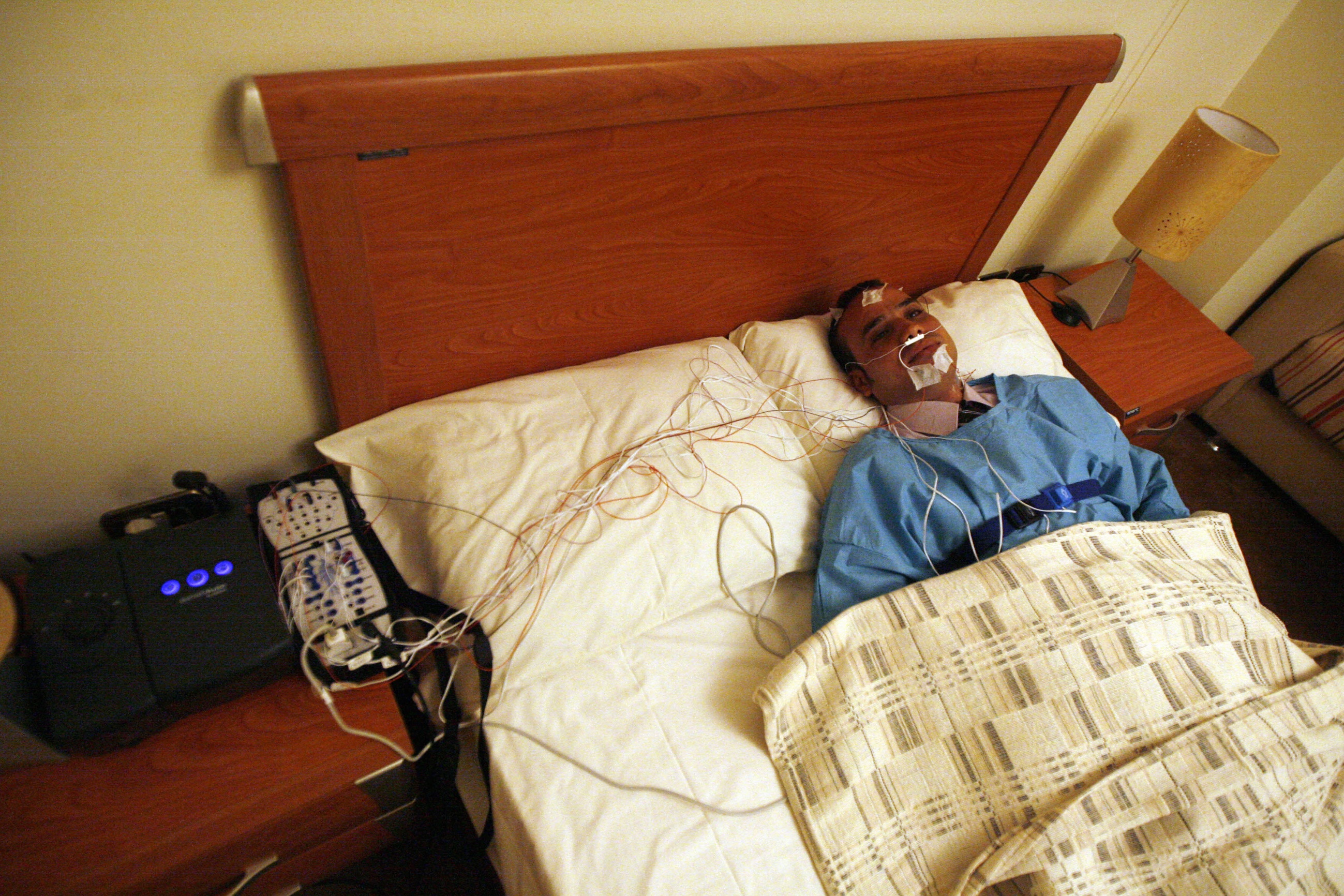 Photo: techtimes.com Egyptian man tries sleep help electronic device