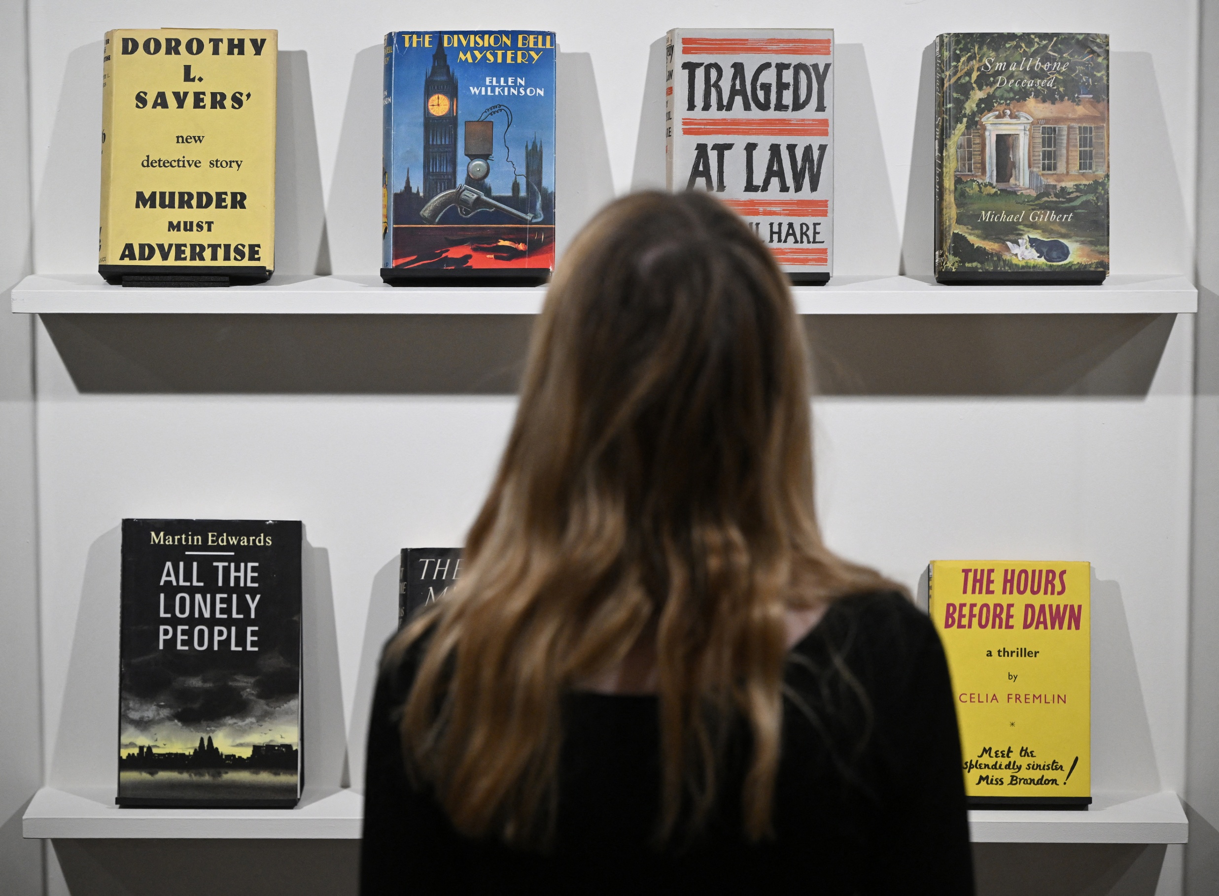 gallery assistant poses early editions press preview